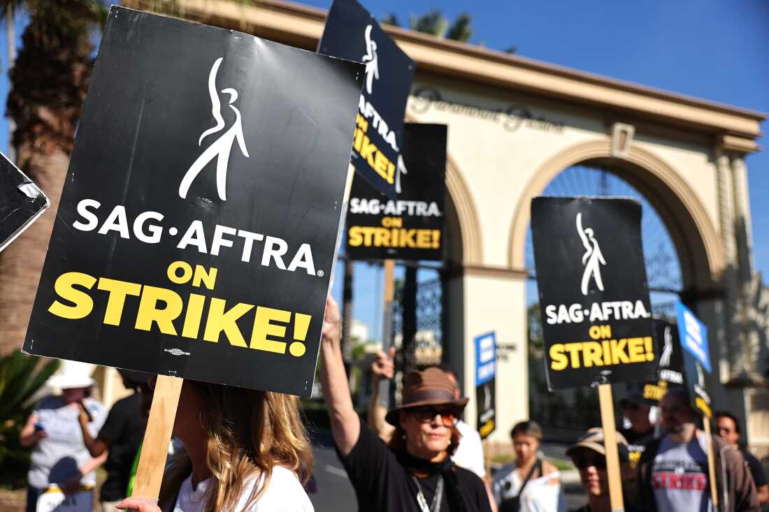 SAG-AFTRA members picket outside Paramount Studios in 2023. Members of the union were on strike between July and November during negotiations with Hollywood film and television studios. Now, the focus is on video games.